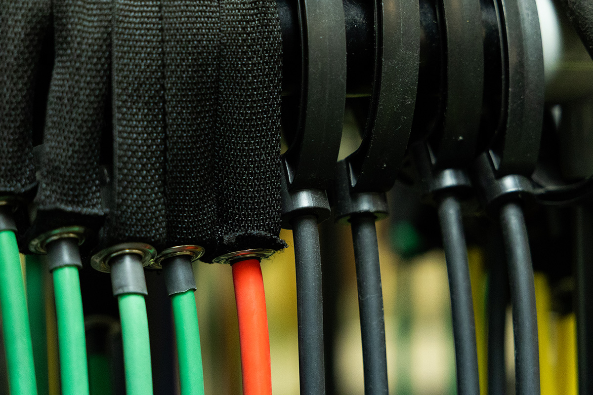 decfdb1f76a83e7c3bba7d6040e5b2dd Children playing basketball in a gym, with two players in red jerseys jumping to reach the ball and two others in purple jerseys actively participating. The YMCA logo is visible in the background, highlighting the community sports environment.
